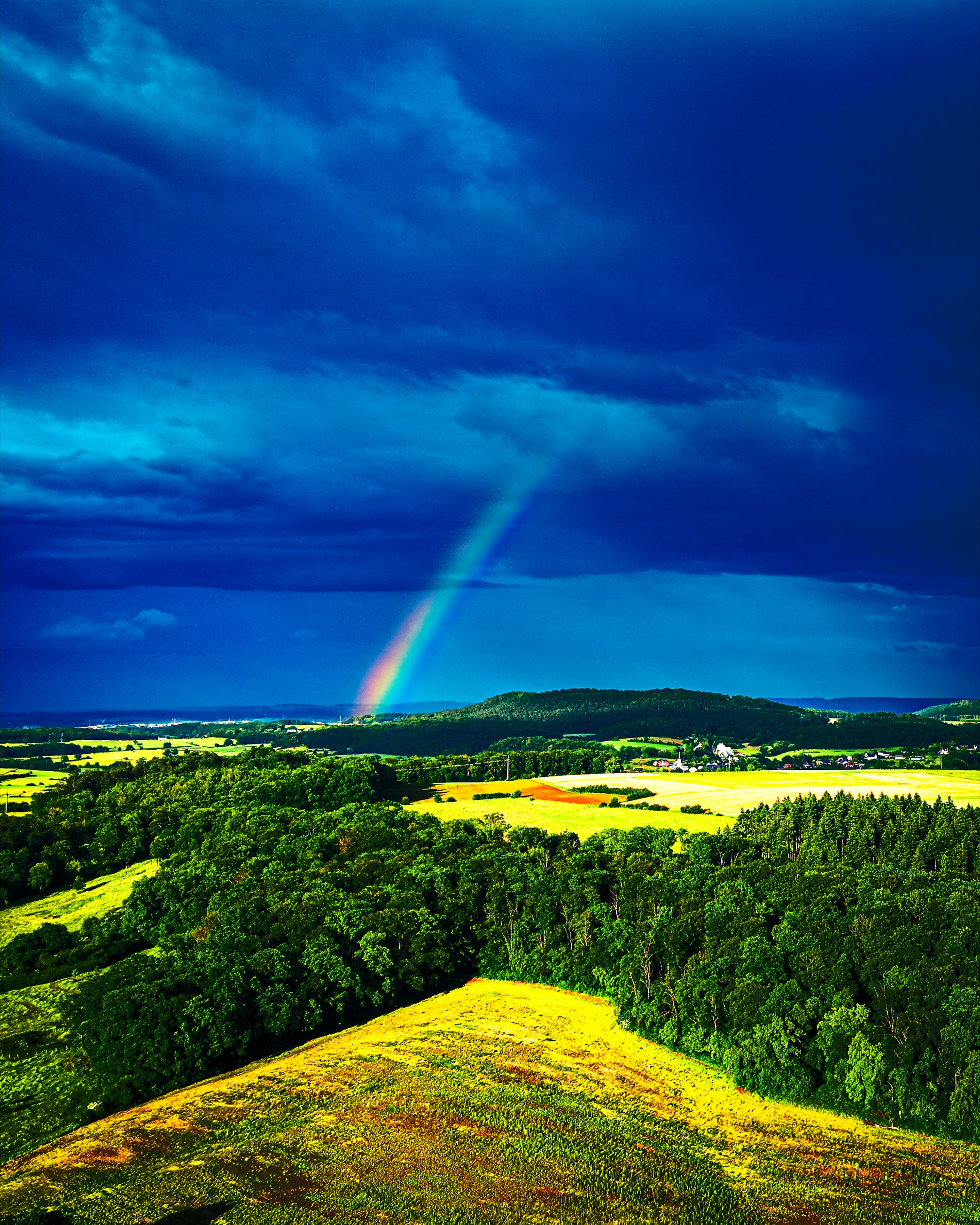 Rainbow over the Éislek hills after the storm